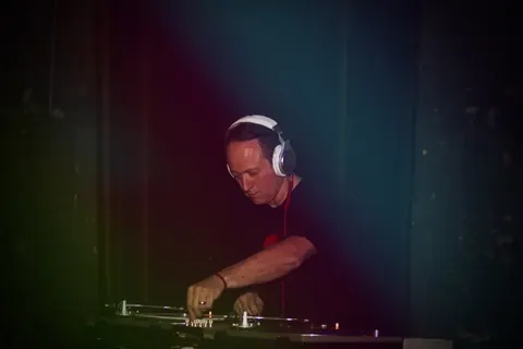 Freddy Fresh at the decks in headphones