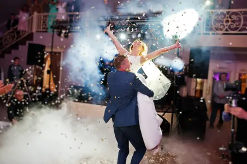 Couple's first dance on a fog-covered dance floor